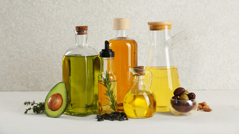 Different cooking oils in glass bottles.