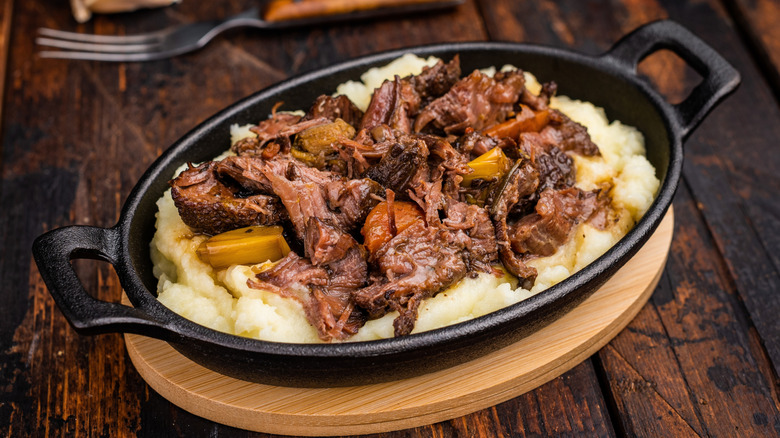 Braised beef cheeks stew on mashed potatoes