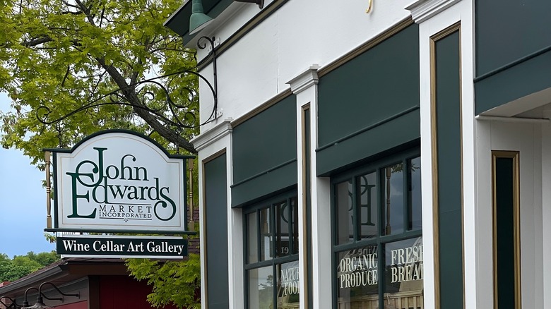Wrought iron sign that reads "John Edwards Market Incorporated"