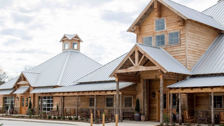Lodge-style wooden building with tin roof