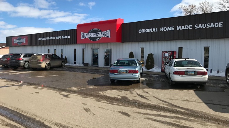 Exterior and parking lot of Stan's Supermarket