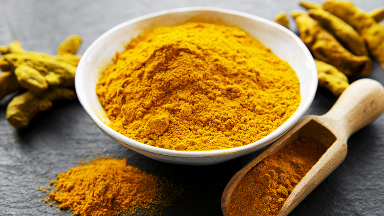 Curry powder in a white bowl with spices