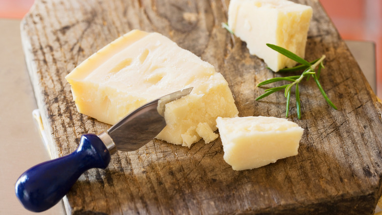 Parmesan cheese block with cheese knife