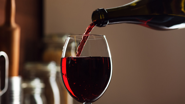 Red wine being poured into a glass