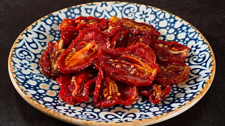 Sun-dried tomatoes on a blue plate