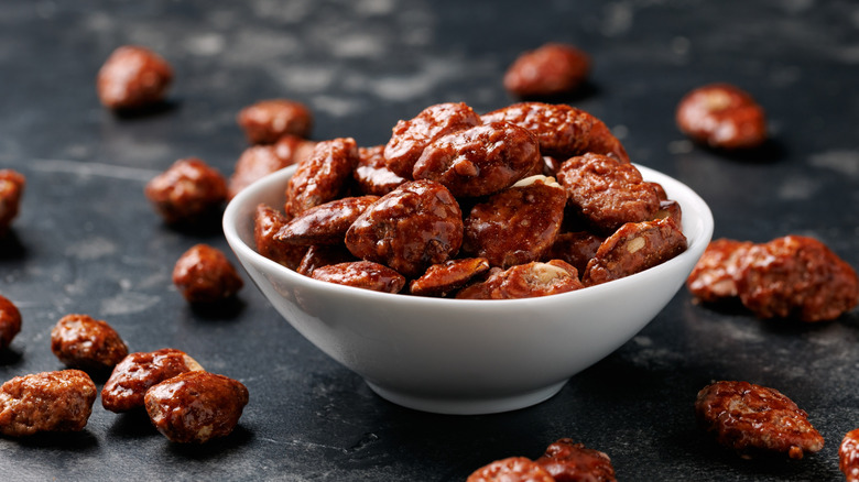 Toasted almonds on a black surface