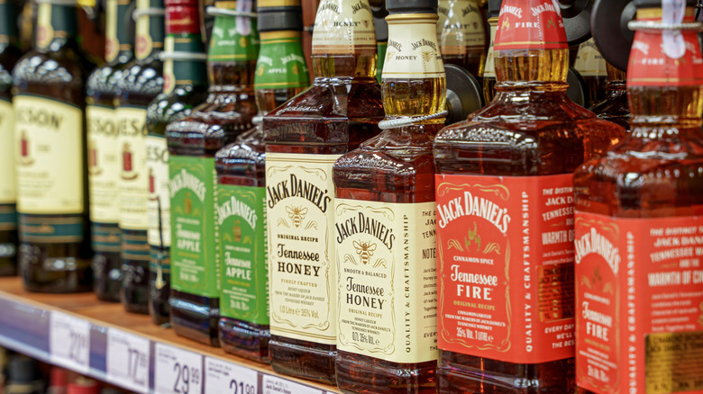 Different bottles of Jack Daniel's on a store shelf
