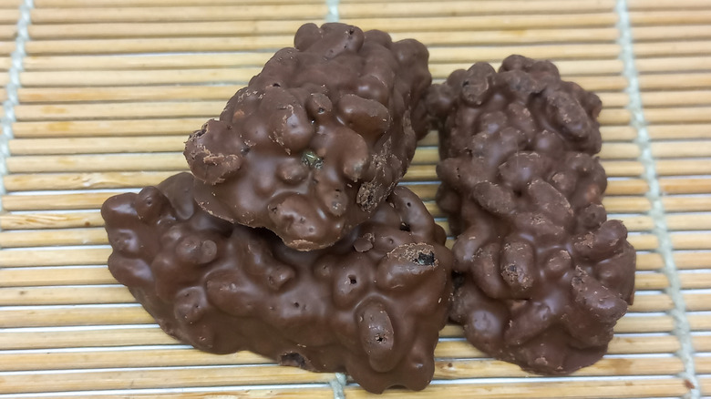 Homemade chocolate clusters on a bamboo mat