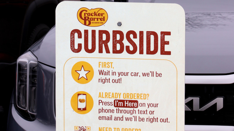 Sign for a Cracker Barrel curbside pickup spot