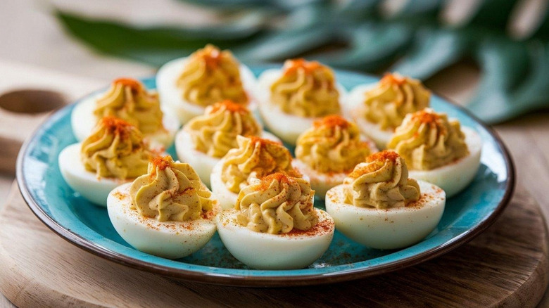 A blue plate of elegant deviled eggs.