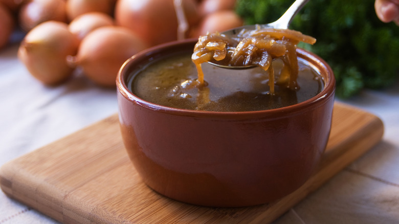 french onion soup in a brown ceramic bowl