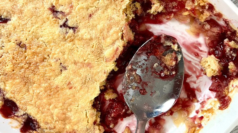 partially eaten tray of dump cake with spoon
