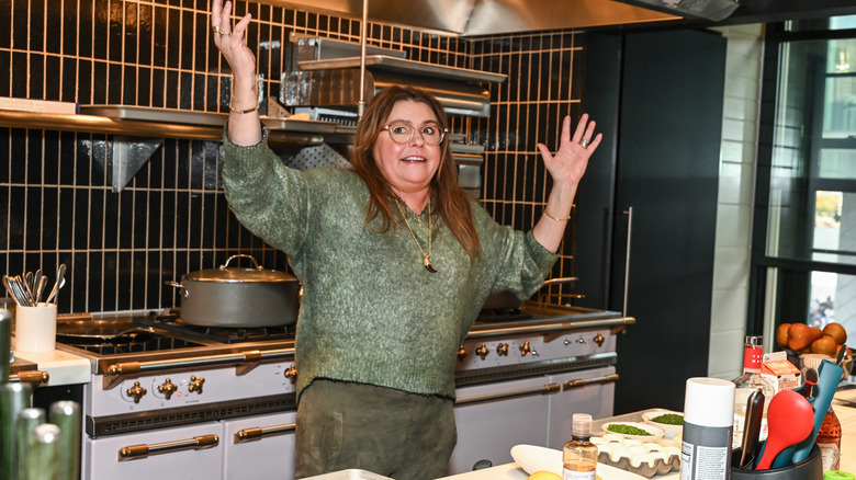 Rachael Ray in a kitchen, preparing to cook