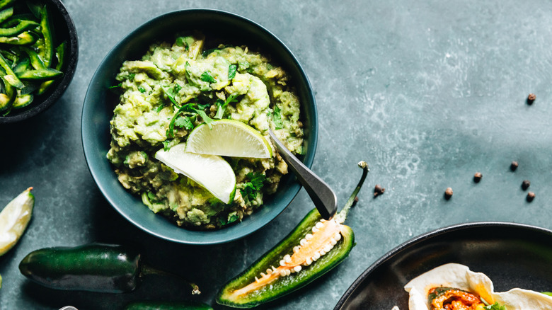 bowl of guacamole with jalapenos