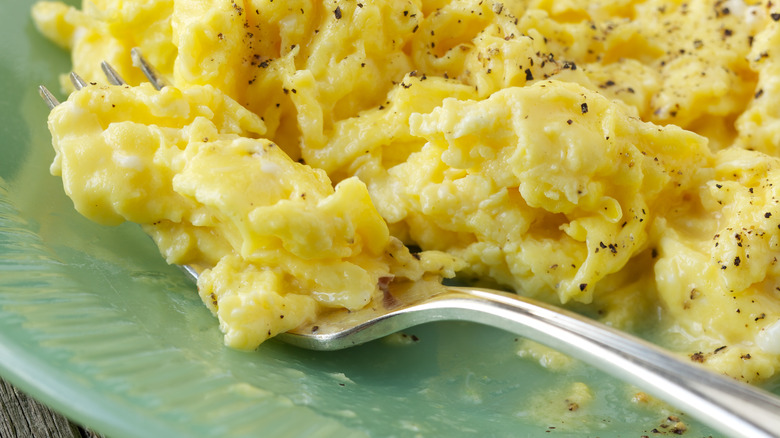 Fluffy scrambled eggs on plate