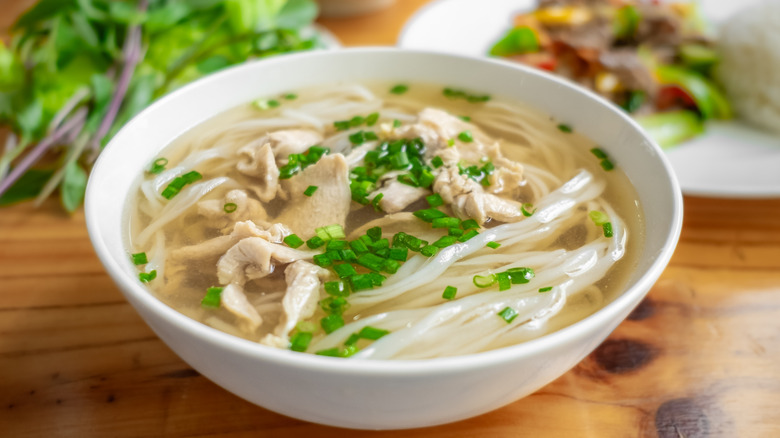white ceramic bowl of chicken noodle soup