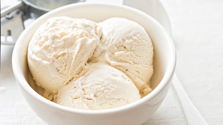 vanilla ice cream scoops in a white bowl