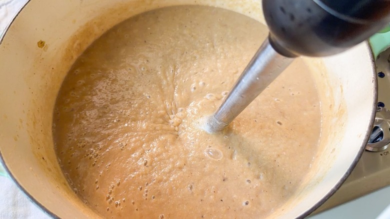 Pureeing cabbage soup in Dutch oven with immersion blender