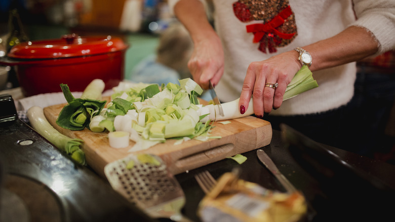 Person chopping leeks