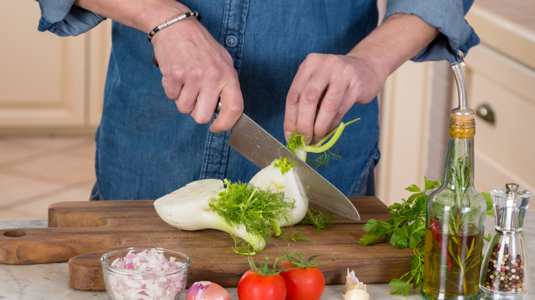 Fennel being chopped on a cutting board