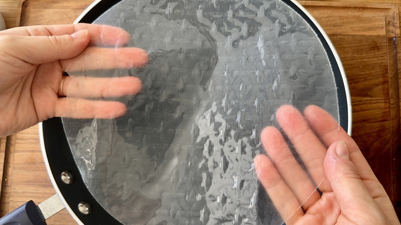 hands holding roll wrapper