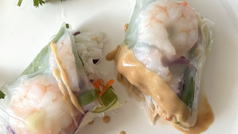 halved shrimp roll with sauce