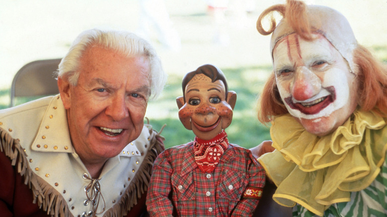 Buffalo Bob Smith, Howdy Doody, and Lew Anderson dressed as Clarabell the Clown posing for a portrait