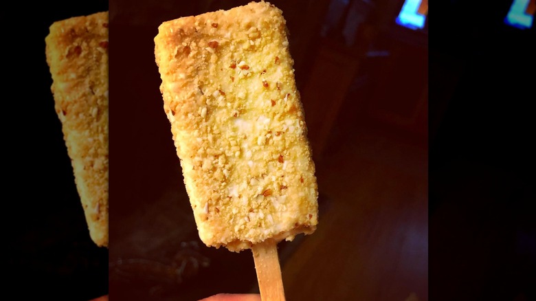 Toasted almond bar on black background