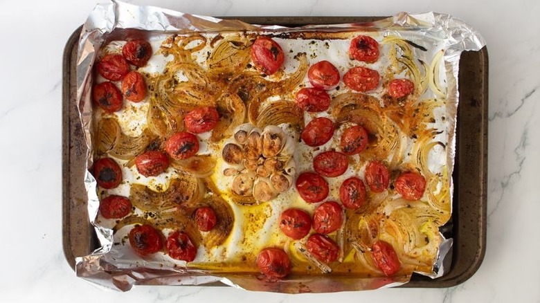 Broiled vegetables on baking sheet