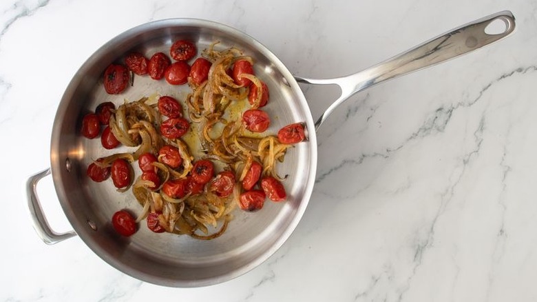 Broiled tomatoes and onion in skillet