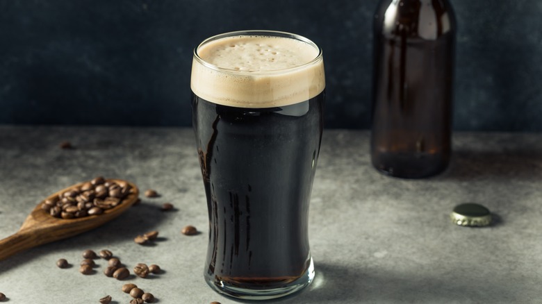 dark beer with coffee beans next to it