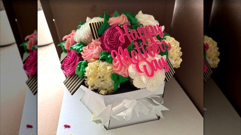 Mother's Day cupcake bouquets from Walmart with pink "Happy Mother's Day" sign in it