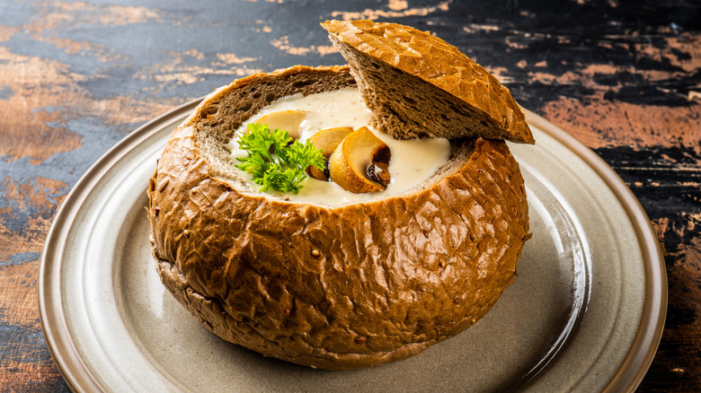 cream of mushroom soup inside a bread bowl