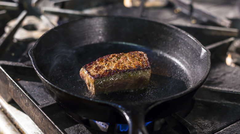 A steak in a cast iron pan.