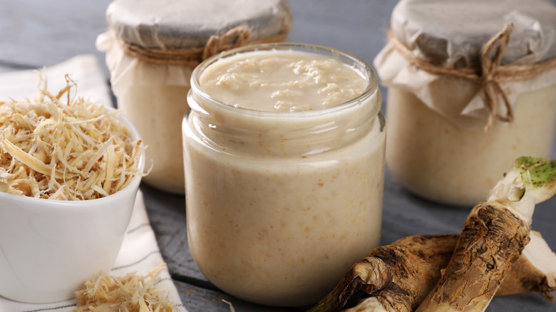 horseradish condiment in three small glass jars