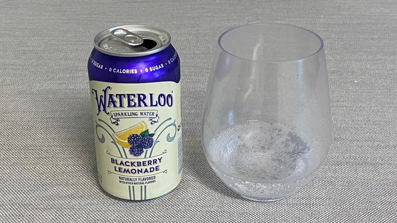 A can of Blackberry Lemonade Waterloo on a table beside a sample in a glass
