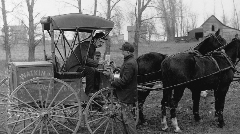 Watkins Man selling remedies from a horse and buggy