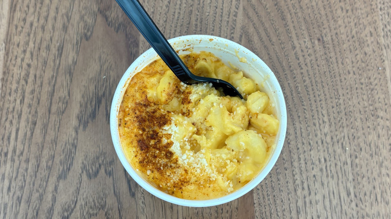 cup of Wawa mac and cheese with seasoning on top