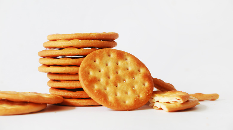 butter crackers stacked on white surface