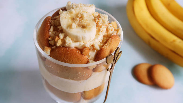 Banana pudding parfait with Nilla Wafers and a bunch of bananas.