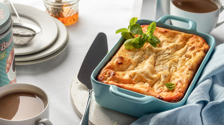 Freshly baked cottage cheese casserole with mint leaves.