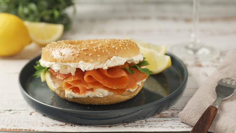 Bagel sandwich with cottage cheese and sliced salmon.