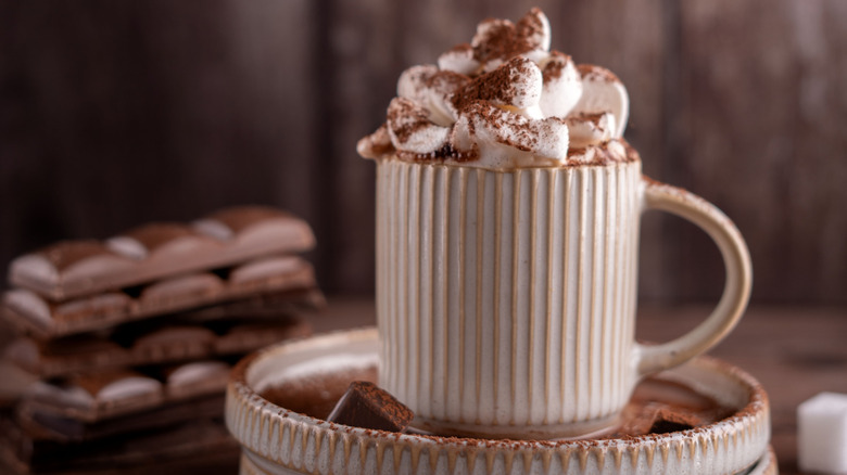 cup with marshmallows and cocoa powder on top
