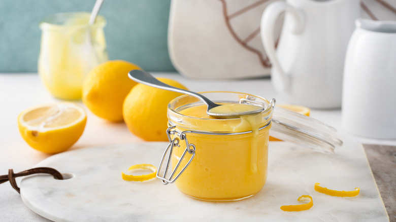 Lemon curd in a glass container.