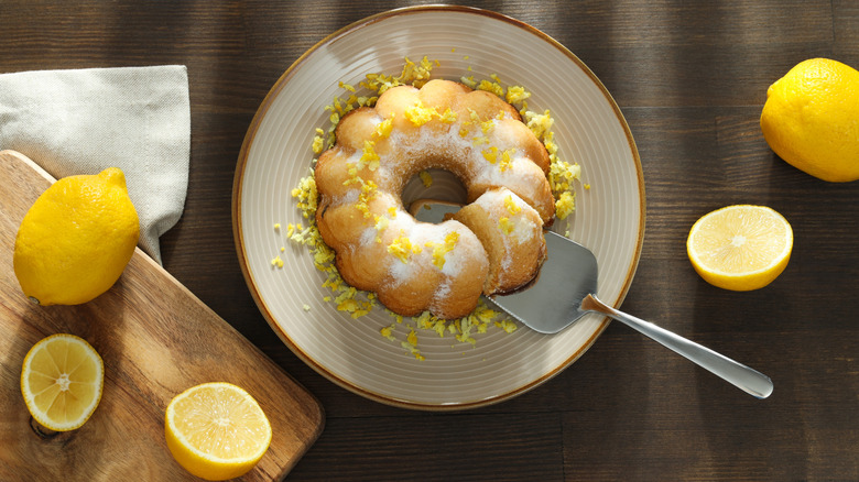 Bundt cake on a plate with lemons