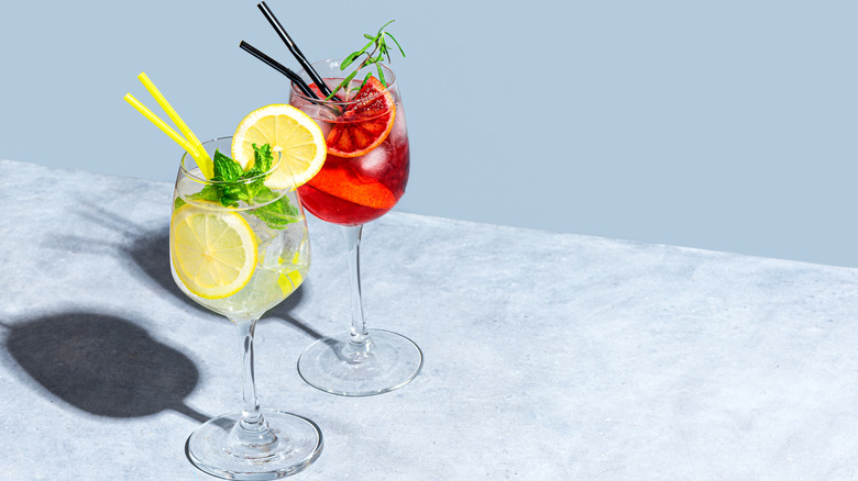 Two cocktails on blue background