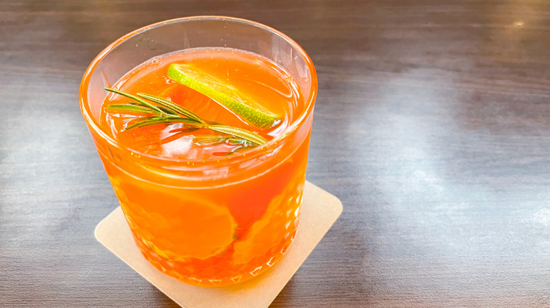 Yuzu and orange cocktail in a glass