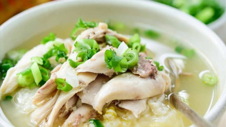 A Korean chicken soup garnished with green onion