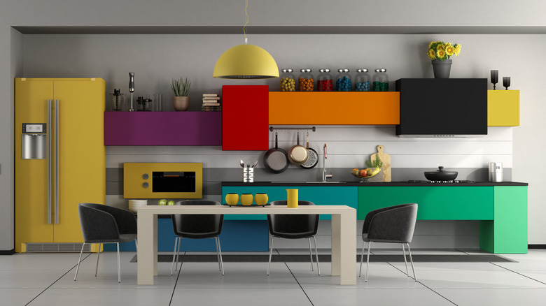 A colorful kitchen characterized by clean lines and bold color-blocking.