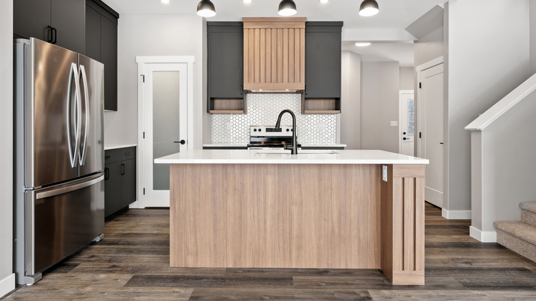 An open-layout kitchen with a big kitchen island in the center.